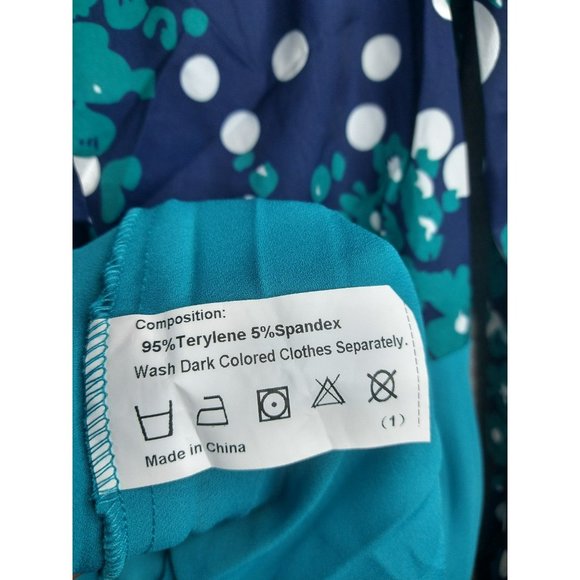 Elegant Pleated Teal Midi Dress with Polka Dotted pattern and front tie bow - Picture 7 of 8